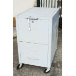 A vintage industrial metal lift top filing cabinet with single drawer under, on large casters -