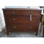 An Edwardian oak chest of three long drawers set on square legs - width 3'