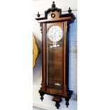 An early 20th Century walnut and part ebonised cased Vienna style regulator wall timepiece, the