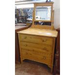 A 31 1/2" early 20th Century waxed pine dressing chest with bevelled swing mirror and three long