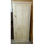 A 35" Victorian painted pine scullery cupboard with shelves enclosed by two panelled doors, set on