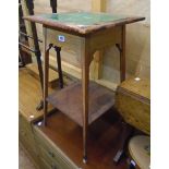 A 16" early 20th Century stripped wood two tier occasional table with green tile inset top, set on