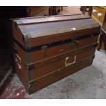 A 29 1/2" late Victorian wood and pressed metal bound dome topped travelling trunk with original