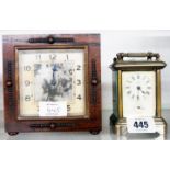 An Ansonia pressed metal cased carriage clock with alarm movement - sold with a small polished oak