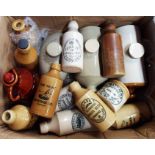 A collection of various Devon local stoneware bottles, etc.