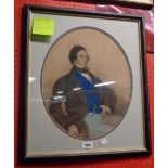 A framed oval slipped 19th Century mixed media portrait of a seated gentleman wearing a blue