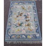 A wool rug depicting a Middle Eastern hunting scene within a fauna and arboreal border - 5' 3" X