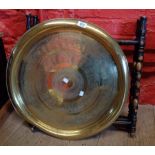 A Benares brass tray top table on ebonised and bobbin turned folding base