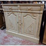 A 3' 4 1/2" continental dresser base with carved decoration, two short drawers and pair of