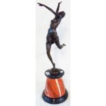 A large bronzed Art Deco style dancing lady