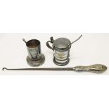 A white metal tankard style mustard pot, a toothpick stand, two small spoons and a button hook