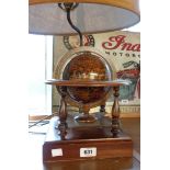 A table lamp in the form of a miniature globe