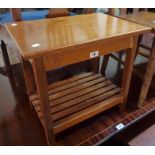 A 21" retro polished teak occasional table with slatted undertier and square supports