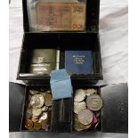 An old cash tin containing a quantity of Great British and foreign coinage including two