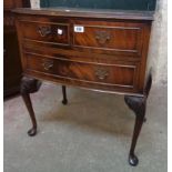 A 24" reproduction quarter veneered flame mahogany bow front bedside chest with two drawers, set