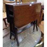 An Edwardian walnut Sutherland table, set on slatted standard ends