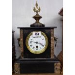 A late Victorian black slate and marble cased mantel timepiece with applied pressed metal finial and