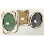 Three silver fronted photograph frames of varying design and condition