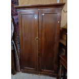 A 3' 11 1/2" Victorian stained pine wardrobe with moulded cornice, shelf, hanging space and drawer