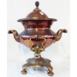 A copper samovar with brass tap