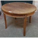 A 24" diameter vintage stained teak occasional table by B. Serota Ltd., bearing War Department stamp