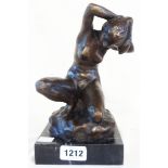 A bronzed seated nude lady on marble base