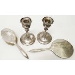 A pair of 5 3/4" Chester silver candlesticks with loaded circular bases - sold with a silver