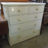 A 3' 6" Victorian painted pine chest of two short and three long graduated drawers, set on squat bun