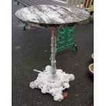 A painted cast iron table base with later circular top