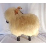 A fleece clad wood footstool in the form of a sheep - one horn a/f