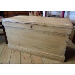 A 36" Victorian waxed pine lift-top box with flanking iron carrying handles