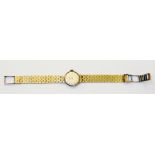 A 9ct. gold Eterna lady's wristwatch with brick-link bracelet