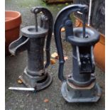 Two cast iron hand pumps