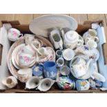 A box containing a quantity of ceramics including assorted decorative cups and saucers,