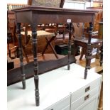 A 28" late Victorian stained wood side table, set on slender turned legs