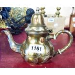 A Persian brassed white metal coffee pot with copper and white metal decoration