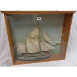 A display case containing a model ketch