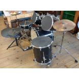 A seven piece Volt by Voggenreiter drum kit with sticks, stool and mutes