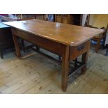 A 5' 9 1/2" fruitwood preparation table with opposing deep drawers and iron drop handles, set on