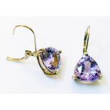 A pair of yellow metal mounted ear-rings, each set with triangular cut amethysts