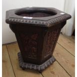 A 12" 1920's Oriental stained hardwood hexagonal jardinière stand of tapered design with carved