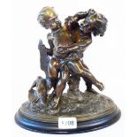 A bronze statue of two young boys fighting over a dead duck, set on a composite socle - bearing