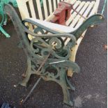 A pair of cast iron bench ends - sold with a parasol base