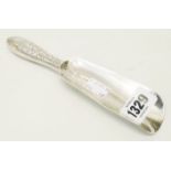 A marked 'Sterling' ornate white metal shoe horn with engraved decoration and stamped B2243