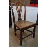 An antique oak framed standard chair with pierced splat back and solid seat - sold with another