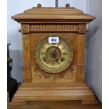 A late 19th Century polished oak cased American shelf clock with Ansonia spring driven gong striking