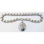 A white metal heavy link collar neck chain with oval locket bearing applied monogram initials