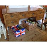 A 4' early 20th Century olive wood kneehole dressing table with strung inlay to quarter veneered