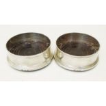 A pair of silver wine coasters with polished wood bases - Birmingham 1987