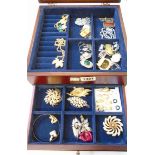 A modern polished wood lift-top and drawer fitted jewellery box containing good quality costume
